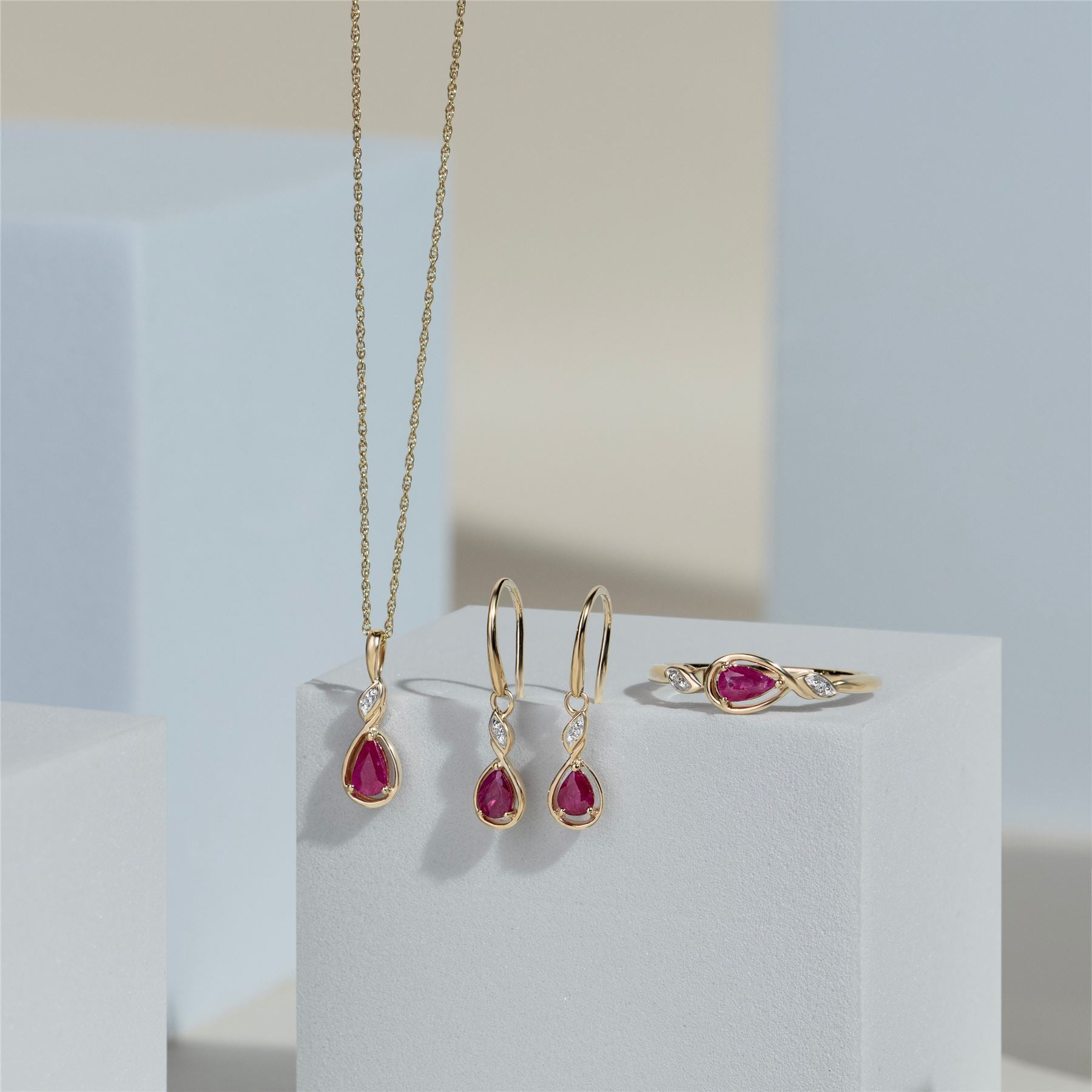 Classic Pear Ruby & Diamond Ring In 9ct Yellow Gold