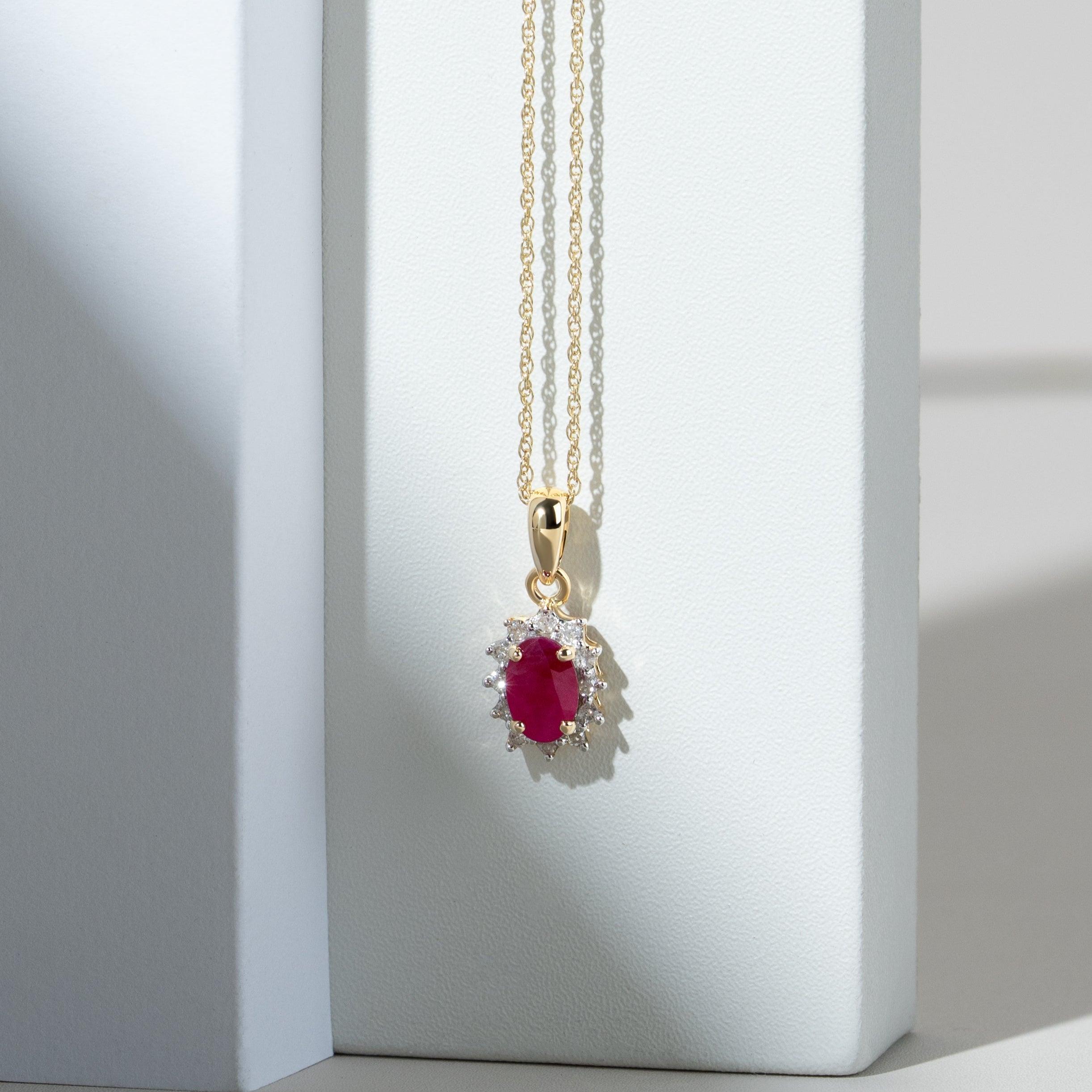 Classic Oval Ruby & Diamond Cluster Pendant in 9ct Yellow Gold