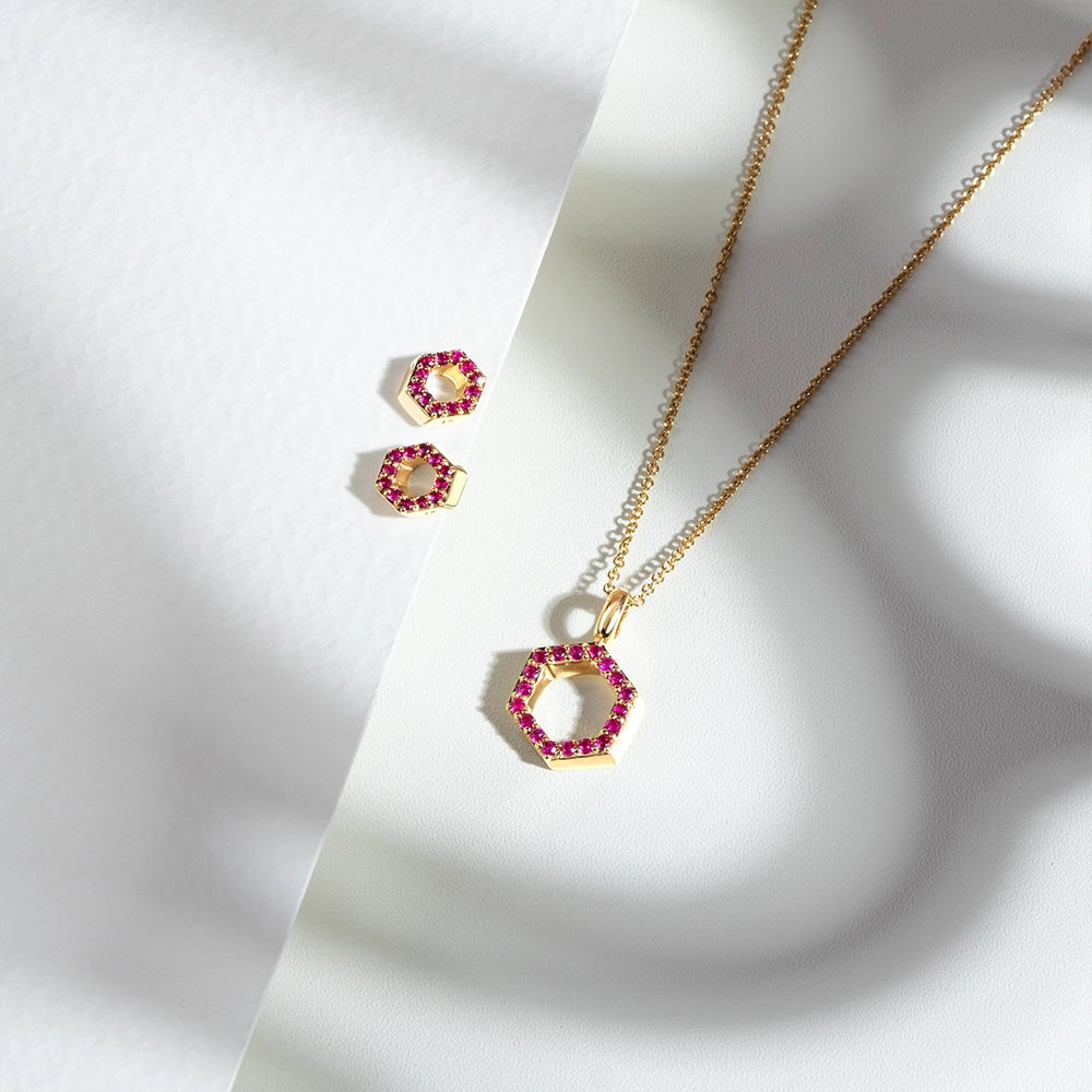 Geometric_hex_ruby_pendant_necklace_and_stud_earrings_in_9ct_yellow_gold