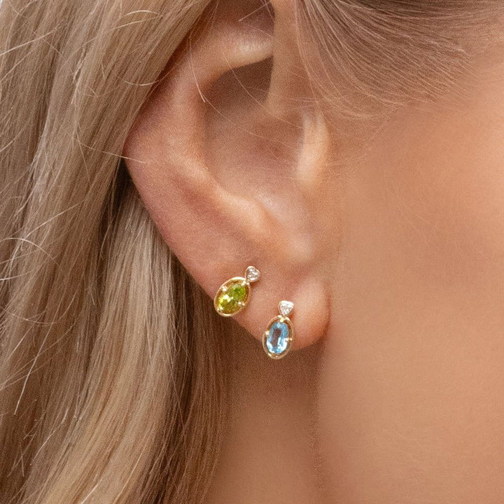 classic-oval-peridot-diamond-heart-stud-earrings-in-9ct-yellow-gold-135e1911039 on Model